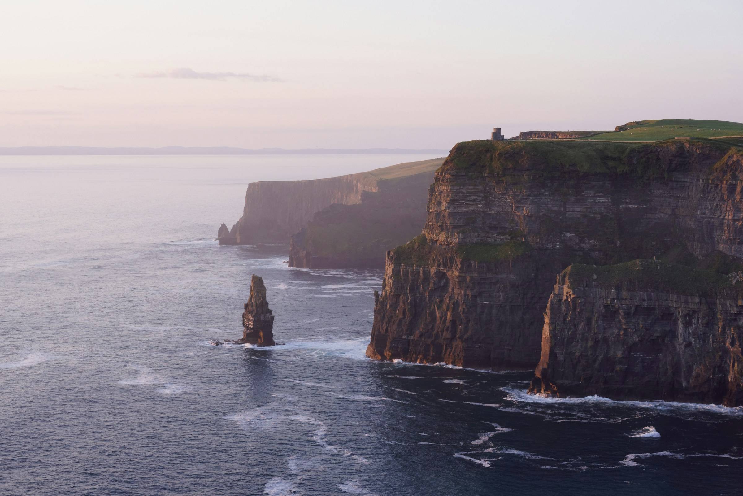 The Cliffs of Moher and O'Brien's Tower at dawn, County Clare